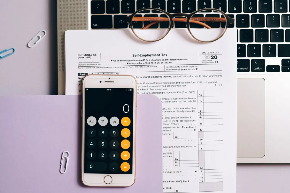 Smartphone calculator over a tax document